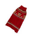 Red knitted dog sweater with reindeer pattern on a beige background
