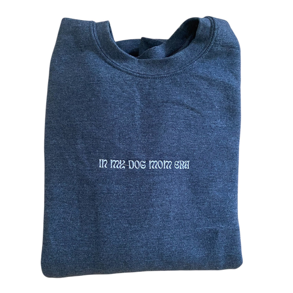 Folded blue sweatshirt with text on a white background