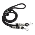 Black dog leash with zebra patterned clips on a white background