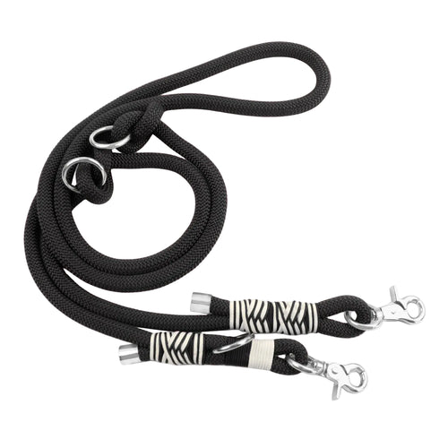 Black dog leash with zebra patterned clips on a white background